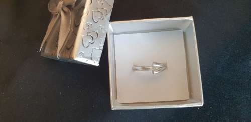 Genuine 18ct white gold hand designed ring with 1 genuine solitaire .10 carat diamond