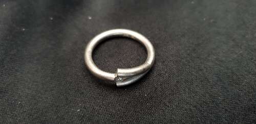 Genuine 18ct white gold hand designed ring with 1 genuine solitaire .10 carat diamond