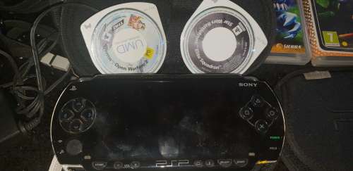 Sony Playstation portable (PSP) with 5 games and 2 pouches and adapter