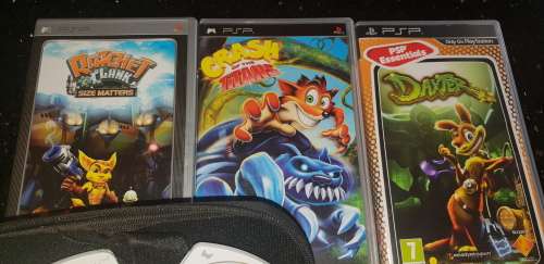 Sony Playstation portable (PSP) with 5 games and 2 pouches and adapter