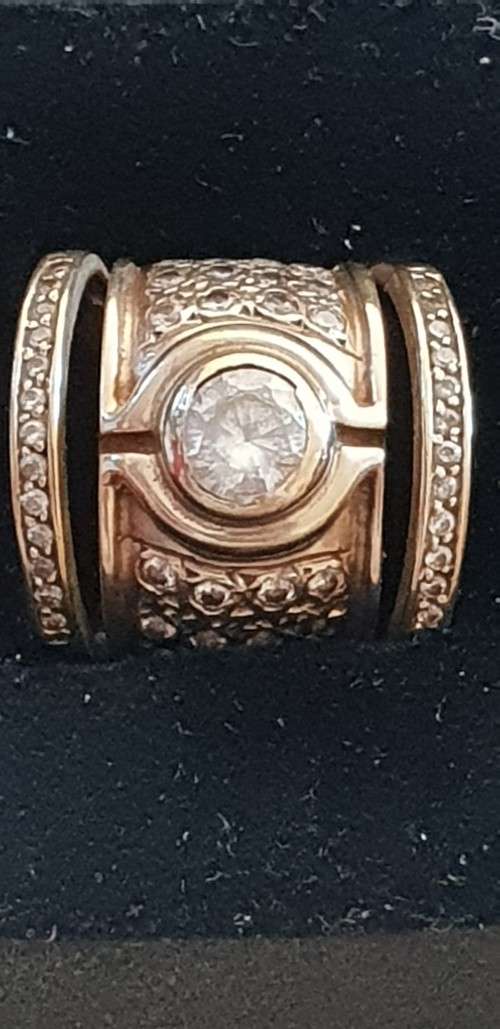 9ct yellow gold and large C.Z broad style band ring with 2 channel set rings either side -joined