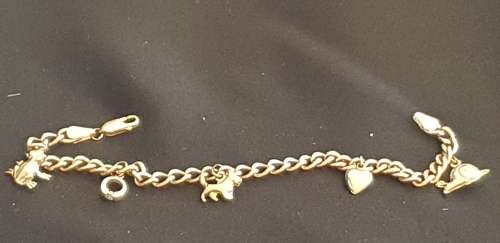 9ct gold charm bracelet with 5 charms attached