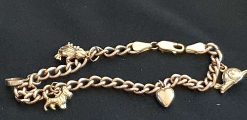 9ct gold charm bracelet with 5 charms attached