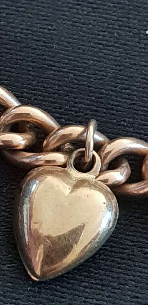 9ct gold charm bracelet with 5 charms attached