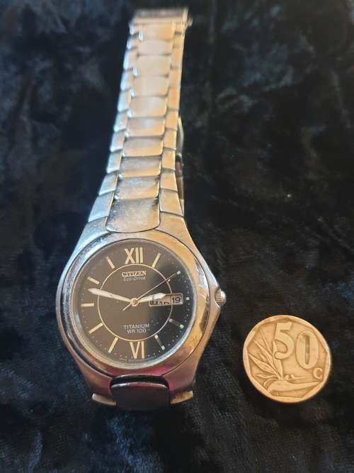 Citizen  Eco-drive W100 titanium black dial watch