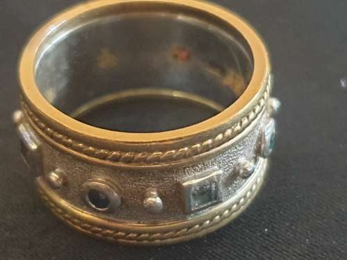 Broad 9ct yellow and white gold band ring with multicoloured stones