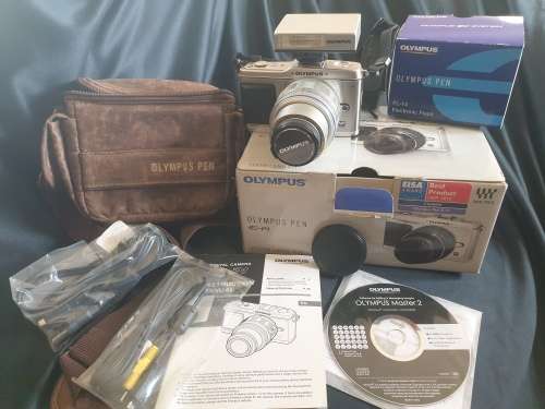 Olympus PEN E-P1 Digital Camera with interchangeable lenses and flash