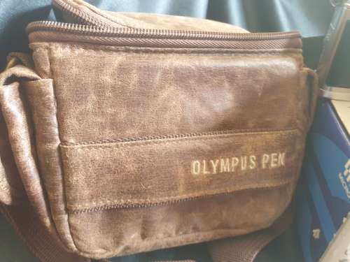 Olympus PEN E-P1 Digital Camera with interchangeable lenses and flash