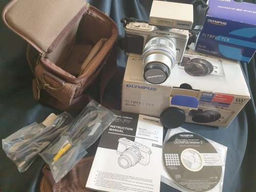 Olympus PEN E-P1 Digital Camera with interchangeable lenses and flash