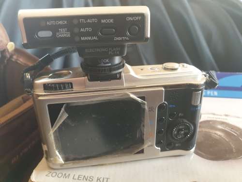 Olympus PEN E-P1 Digital Camera with interchangeable lenses and flash