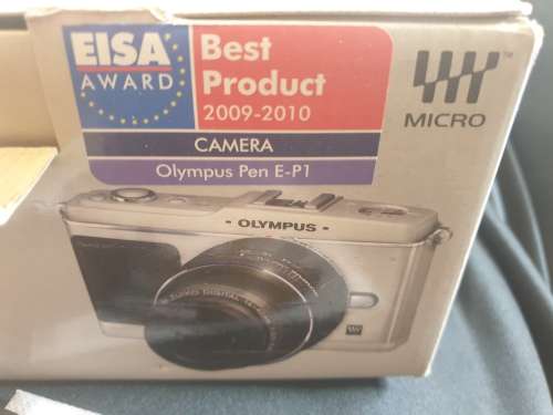 Olympus PEN E-P1 Digital Camera with interchangeable lenses and flash