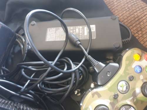 Xbox 360 E slim black console with 2 controls and Kinect in box