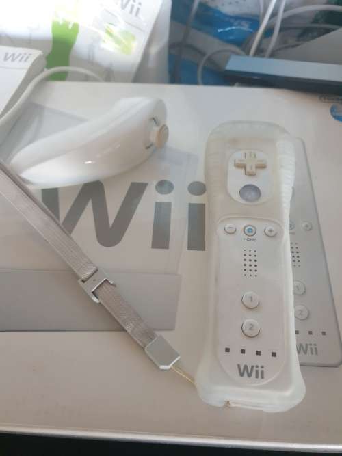 Wii console with Wii fit mat and game,1 control.1 nunchaka and Wii move dance mat