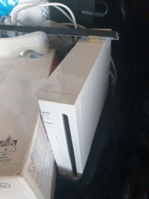 Wii console with Wii fit mat and game,1 control.1 nunchaka and Wii move dance mat