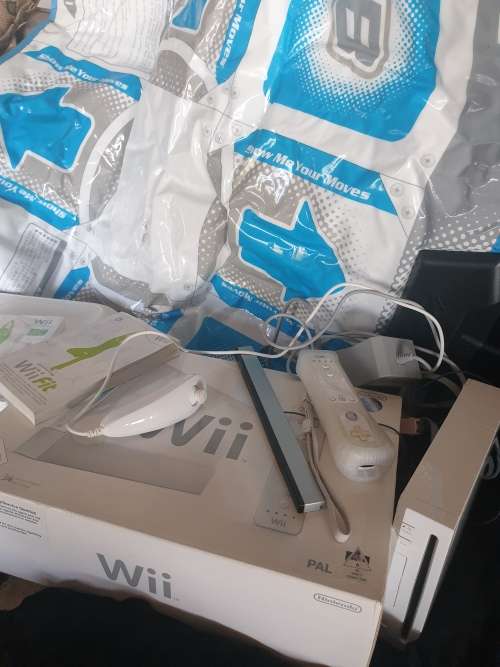 Wii console with Wii fit mat and game,1 control.1 nunchaka and Wii move dance mat