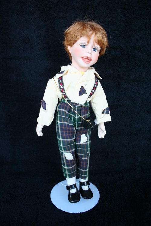 PORCELAIN BOY/GIRL  DOLL--FULLY DRESSED WITH STAND