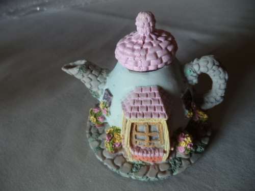 Cute Little Teapot With a family of Mice
