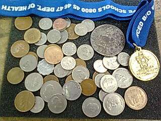 Mix world coins, a token and a medal
