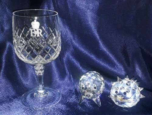 Collection: One Commemorative (Queen Elizabeth II) wineglass and 2 Swarovski Chrystal figurines