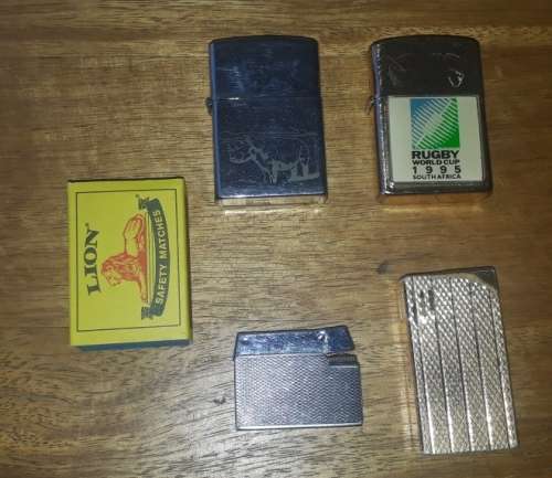 A Collection of 4 Lighters, including 2 Lighters