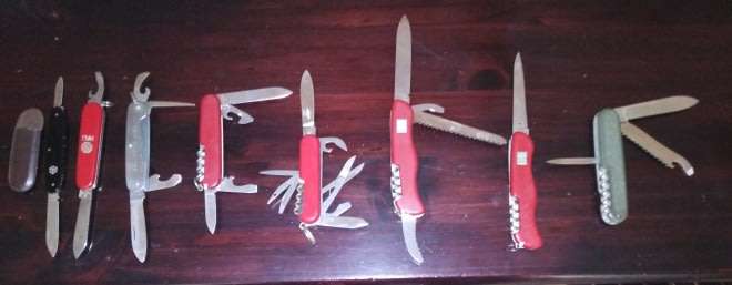 A Collection of 8 multi-blade or multi-purpose pocket knives  including 5 Victorinox knives