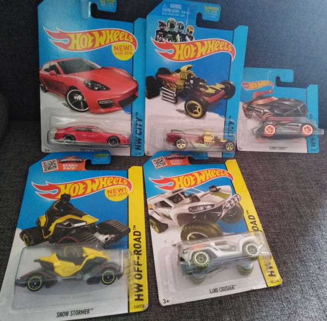 A Collection of Five Hot Wheel Models Still Sealed in Original Packaging