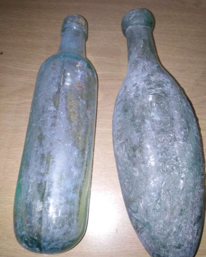 Four Vintage Bottles With a Round or Torpedo Base