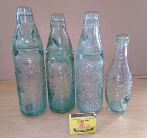 Collection of 4 Antique Bottles in Good Condition with Trapped Air Bubbles