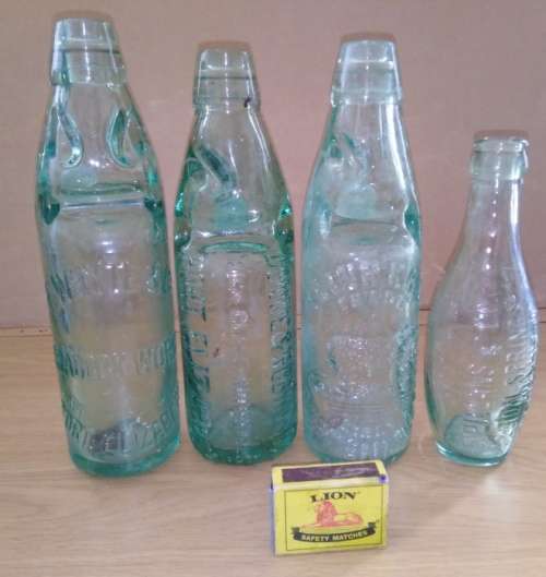 Collection of 4 Antique Bottles in Good Condition with Trapped Air Bubbles