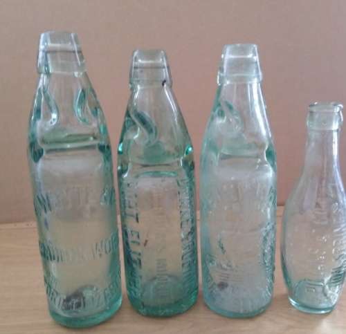 Collection of 4 Antique Bottles in Good Condition with Trapped Air Bubbles