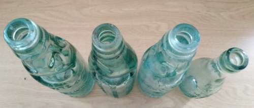 Collection of 4 Antique Bottles in Good Condition with Trapped Air Bubbles