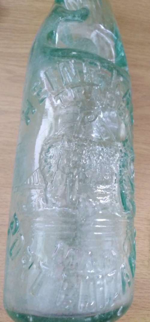 Collection of 4 Antique Bottles in Good Condition with Trapped Air Bubbles