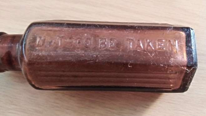 A Collection of 4 Vintage Medicine Bottles and a Holloway Ointment Pot