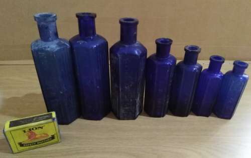 A Collection of 7 Cobalt Blue Hexagonal bottles
