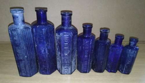 A Collection of 7 Cobalt Blue Hexagonal bottles