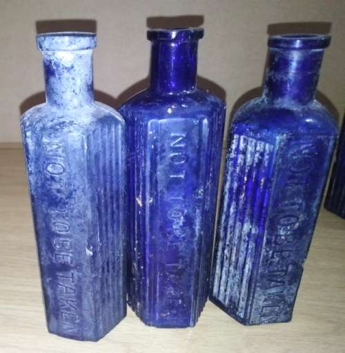 A Collection of 7 Cobalt Blue Hexagonal bottles