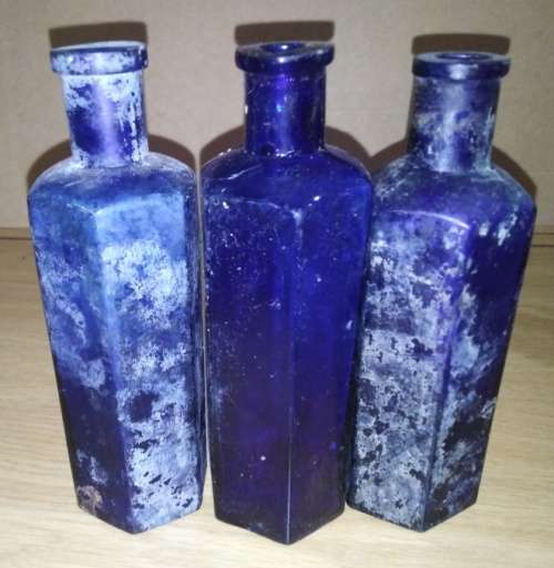 A Collection of 7 Cobalt Blue Hexagonal bottles