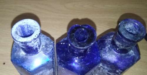 A Collection of 7 Cobalt Blue Hexagonal bottles