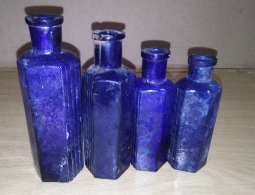 A Collection of 7 Cobalt Blue Hexagonal bottles