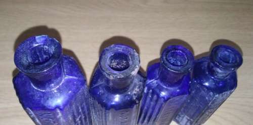 A Collection of 7 Cobalt Blue Hexagonal bottles