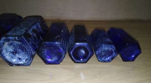 A Collection of 7 Cobalt Blue Hexagonal bottles
