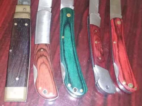 A Collection of 5 Folding Knives with Wooden Handles