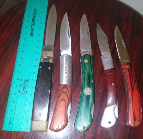 A Collection of 5 Folding Knives with Wooden Handles