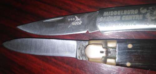 A Collection of 5 Folding Knives with Wooden Handles