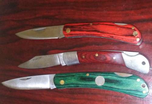 A Collection of 5 Folding Knives with Wooden Handles