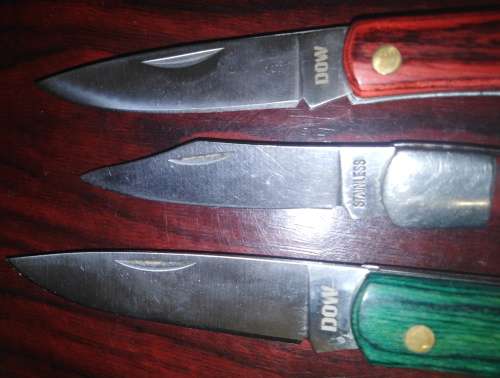 A Collection of 5 Folding Knives with Wooden Handles
