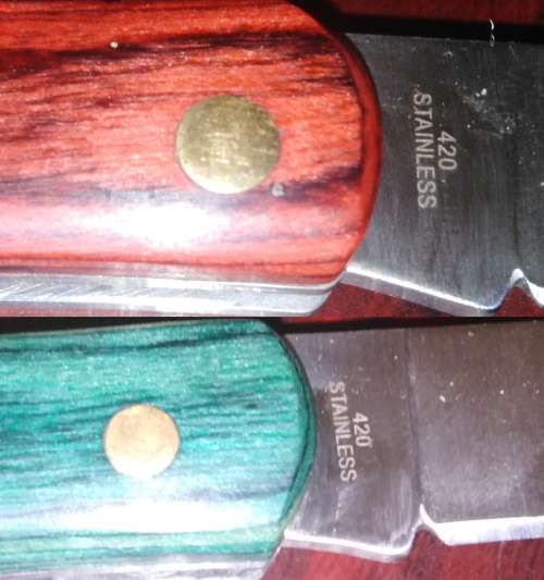 A Collection of 5 Folding Knives with Wooden Handles