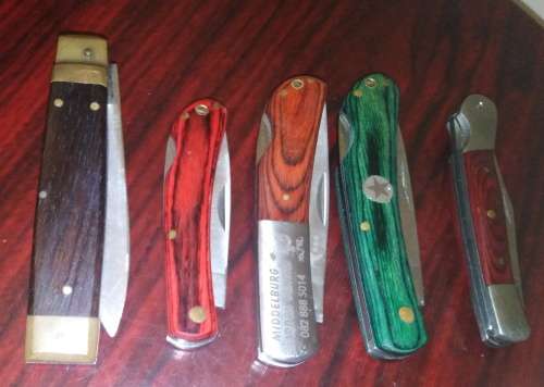 A Collection of 5 Folding Knives with Wooden Handles