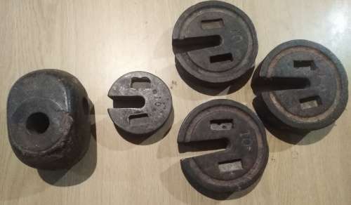 Four Vintage Slotted Scale Weights (measurements units in pounds) and one other weight