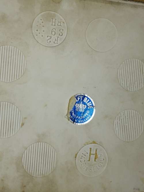 A Collection of three Delft tiles with windmill theme and one tile holder